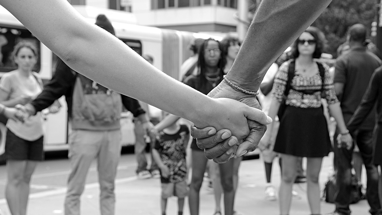 students holding hands in protest