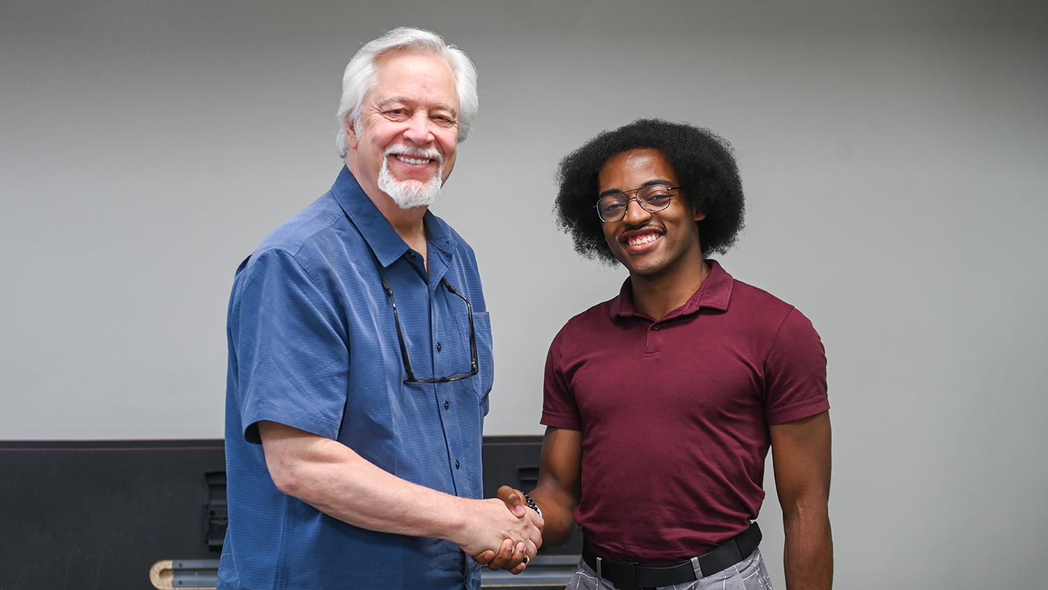 Hudson shakes hands with Dean Phillips