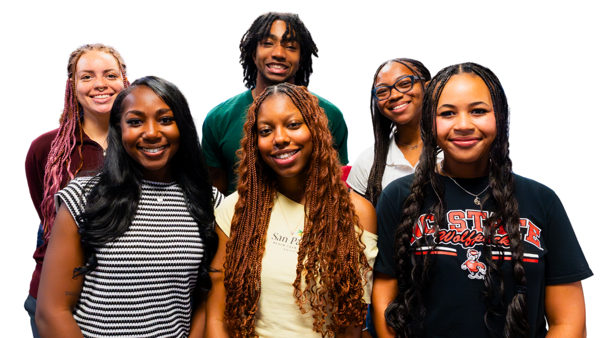 Six people stand smiling against a black background. They are dressed casually and convey a sense of unity and positivity, showcasing diverse hairstyles.